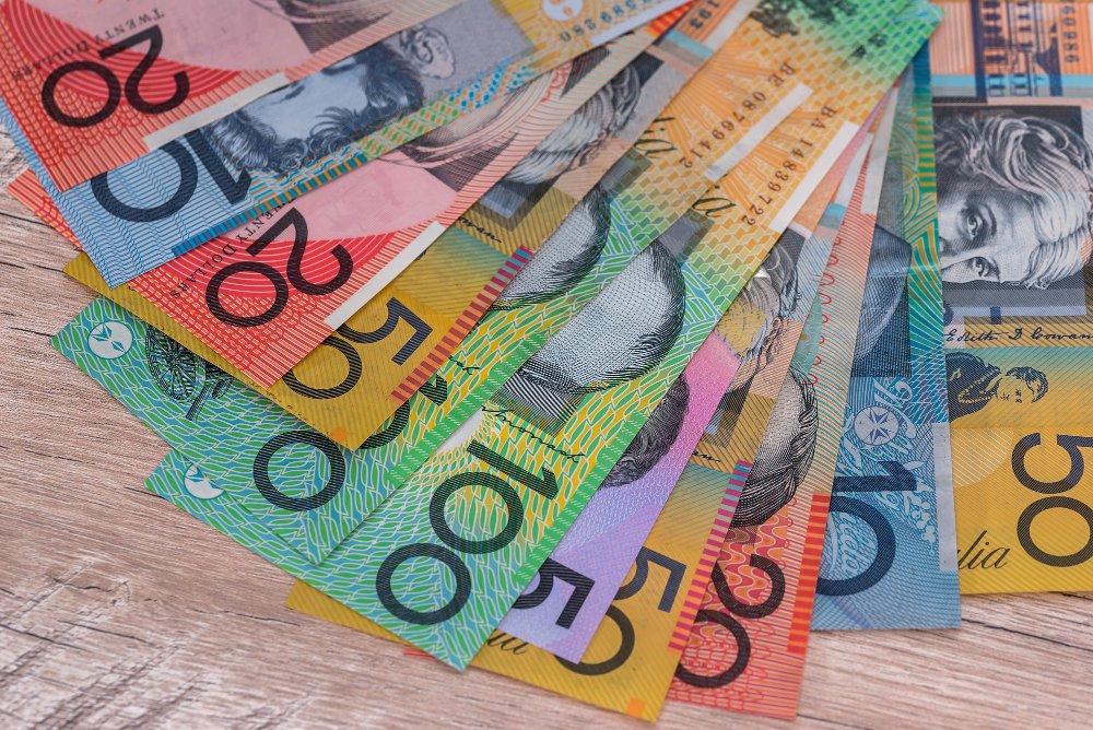 australian dollars fan wooden desk